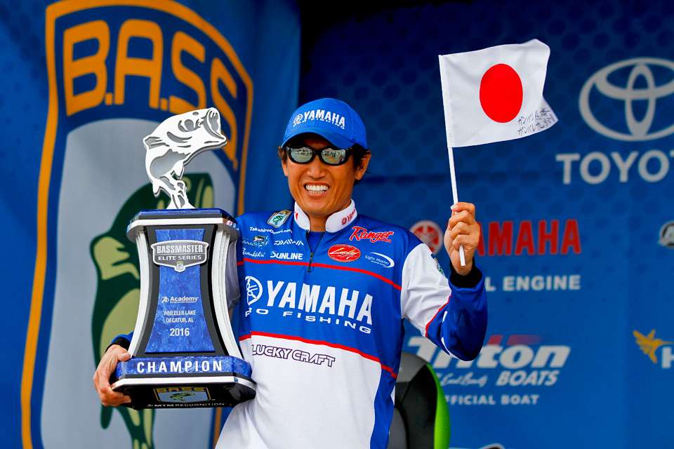 Omori holds his first Elite Series trophy and a flag from his homeland of Japan. Written on the flag in Japanese was an encouraging message to the people of Japan that were victims of a devastating earthquake. 