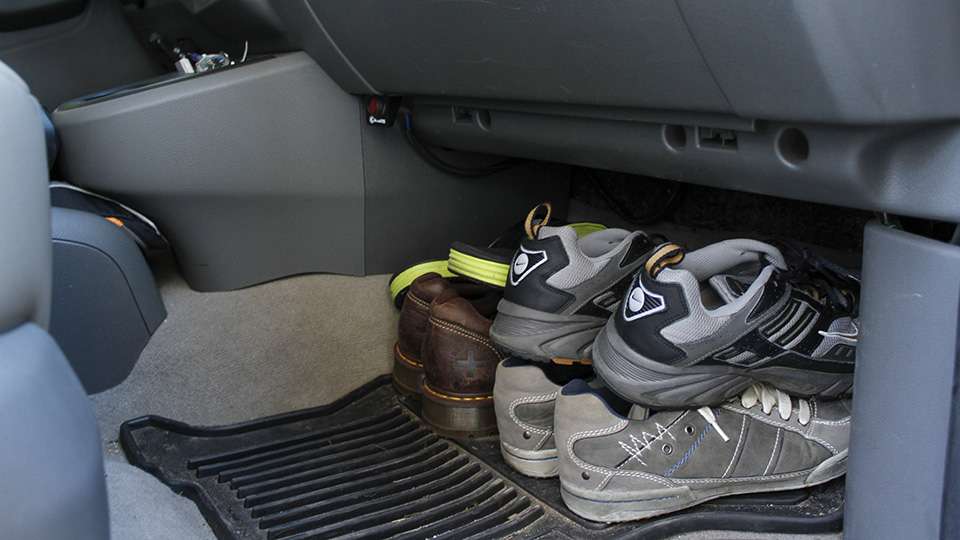 He keeps a couple pairs of shoes in the front floorboard. 