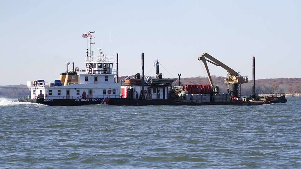 A Coast Guard barge cruises by on its way to the Paris Landing State Park.