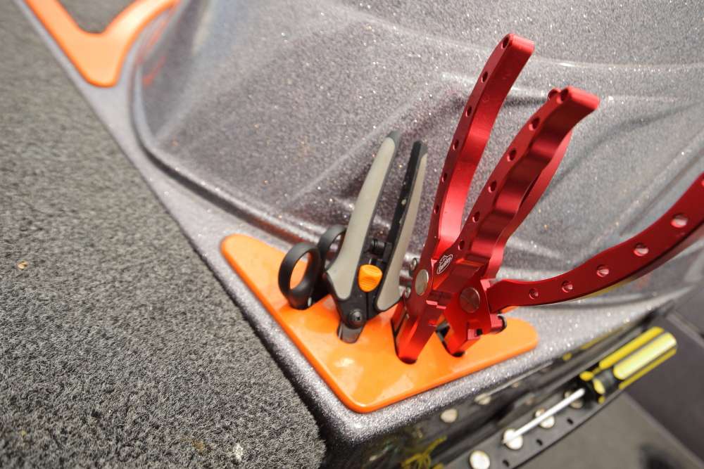 Lane says this storage space for scissors, pliers and other tools makes it easy to grab needed items. The special red pliers are manufactured by Berkley.