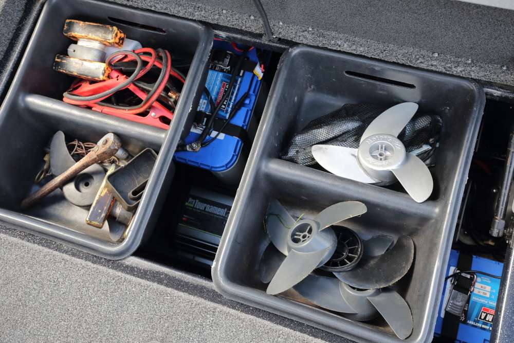 The boat's deep battery box allows for add-in storage bins. These bins hold extra trolling motor props, cables, tools, a marker...