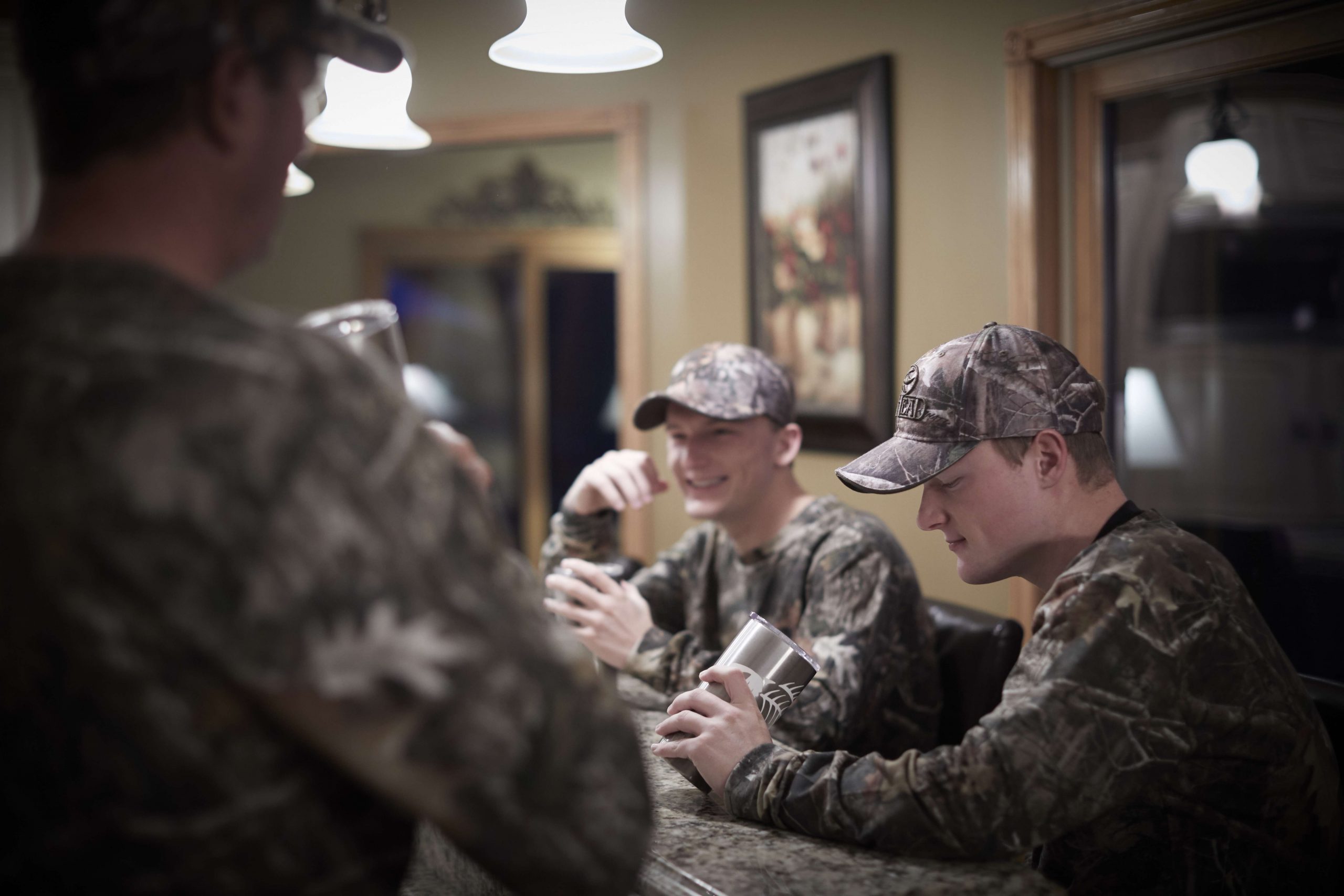 Hunting provides a bonding experience for the three men, as well as a bit of competition. Jackson and Nicholas discuss which stands to go to based on what has been showing up on the trail cameras.