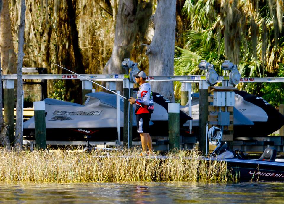 Brent Bonadona eases his boat alongside one of the hundreds of boat docks that could be fished. 