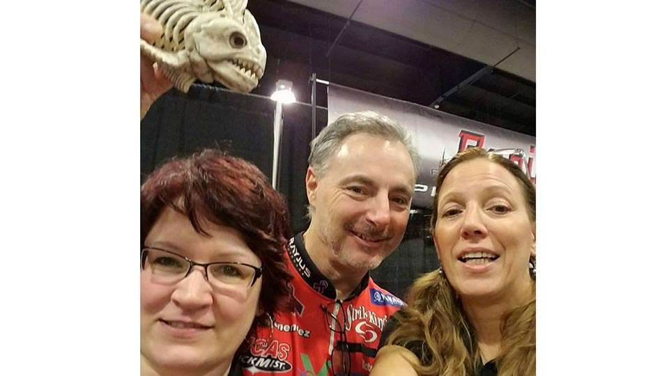Like most Elites, Mark Menendez made the show rounds. Here he works the Rapid Fishing Solutions booth at the Greater Niagara Sport and Fishing Show. He gave seminars and enjoyed working with folks like Andrea Blakelock and Jennifer Lowe, who got photobombed by âBones,â the RFS mascot!