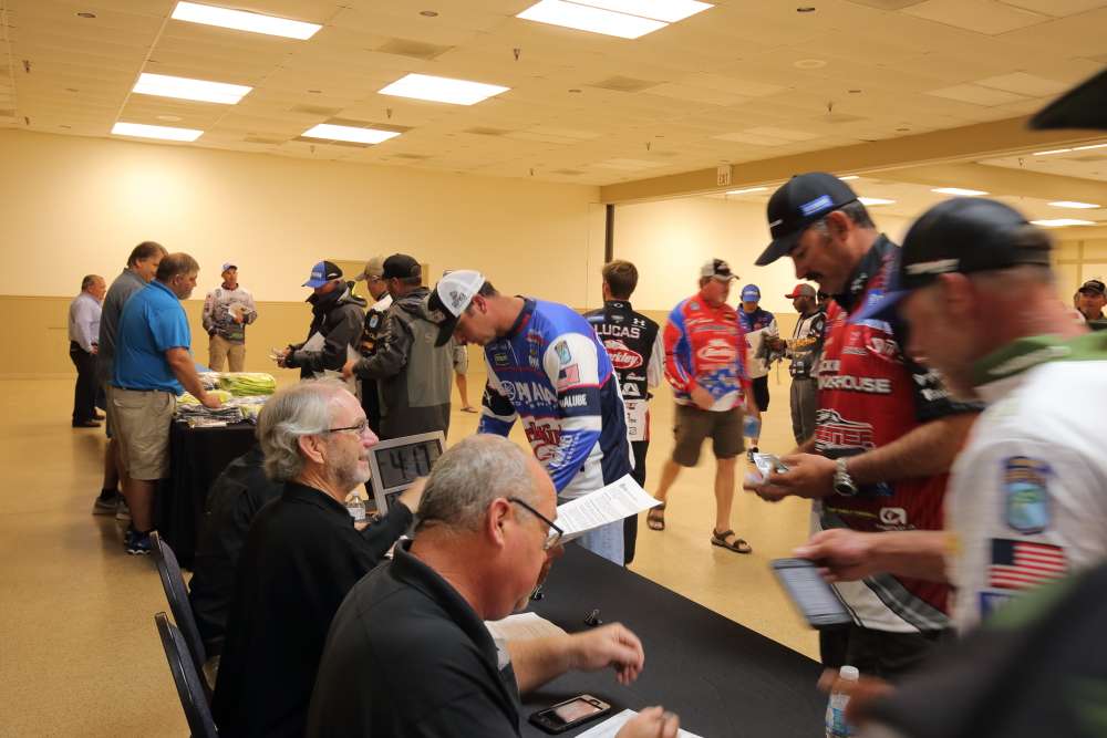 Anglers submit to their pre-tournament fishing license check.