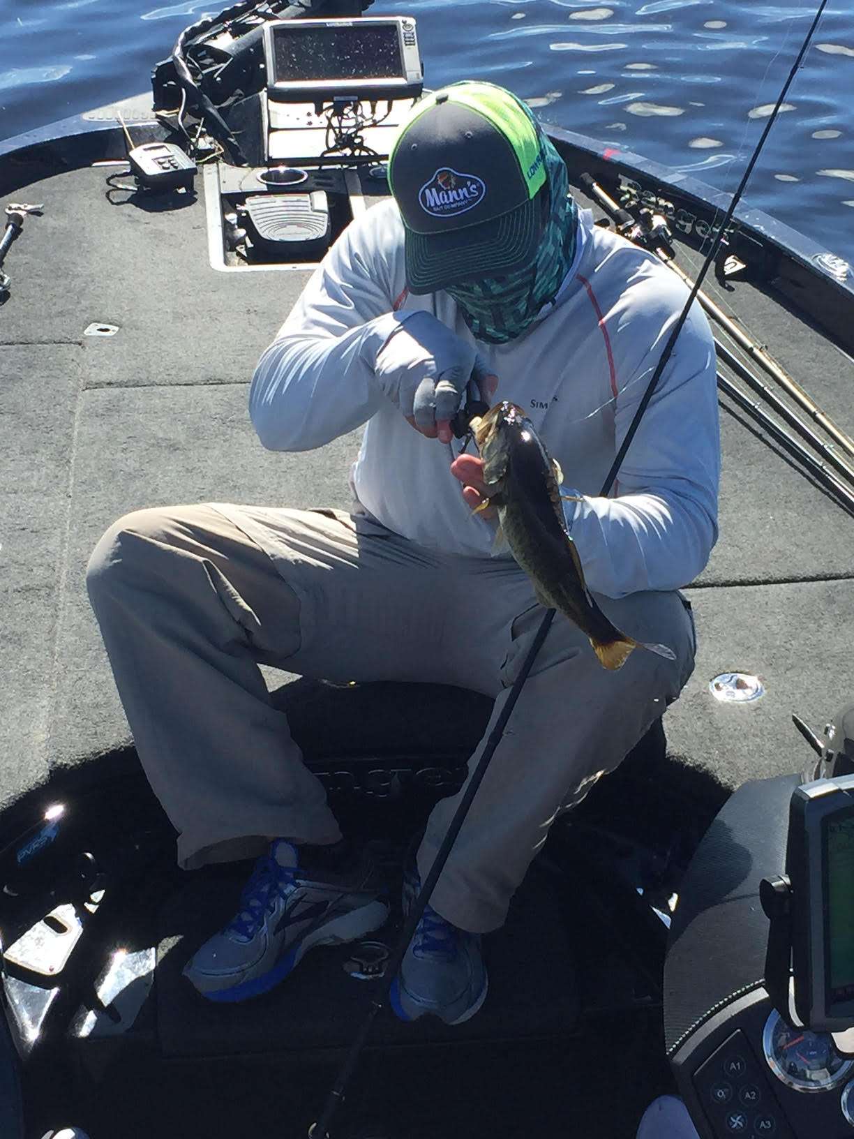 Micah moves back out to casting ChatterBait and catches a 1-pound fish on it. There are a lot of boats on this flat.