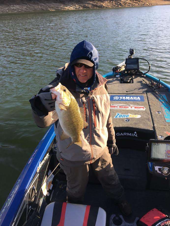 Alton Jones Sr. breaks the ice, no pun intended, with a nice keeper smallie. 

