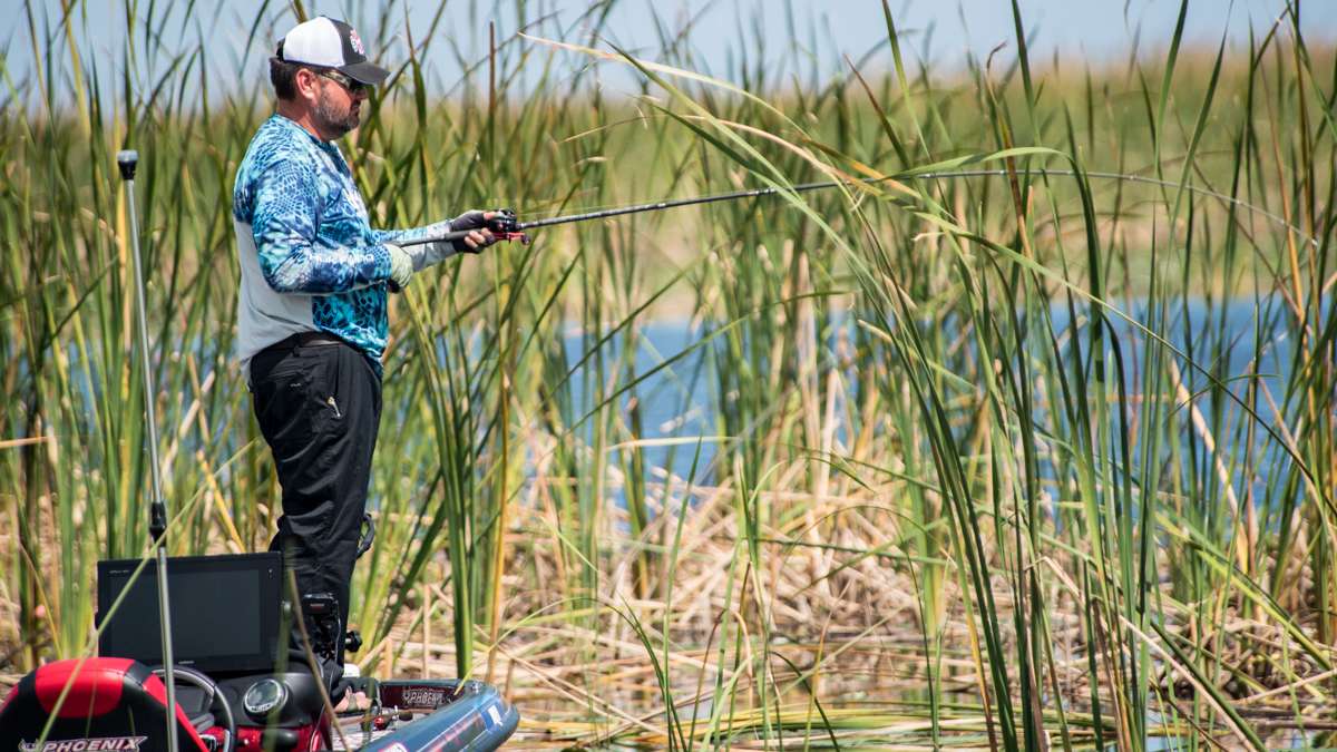 Hackney was fishing slow and letting his jig fall through and below the matted grass that was around the tall Kissimmee grass.