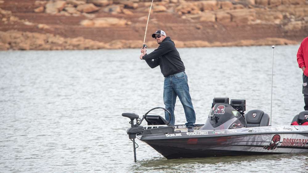 Mullins whips his little crank bait at the bank. 
