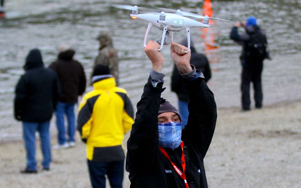 Bassmaster.com digital staffer Gettys Brannon latches on to the drone for a safe landing.