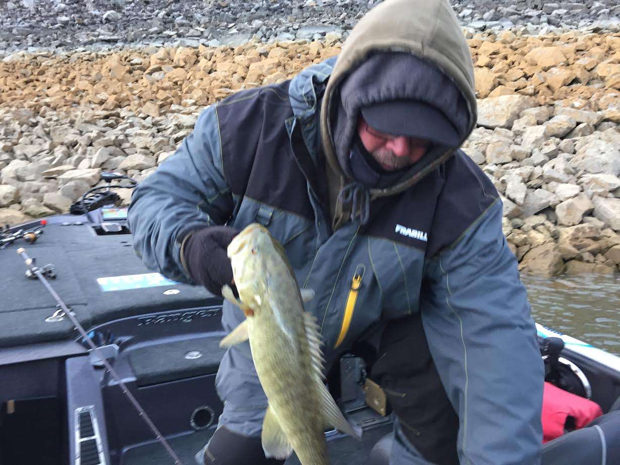 John Murray adds a 2-pound smallmouth to his bag. 