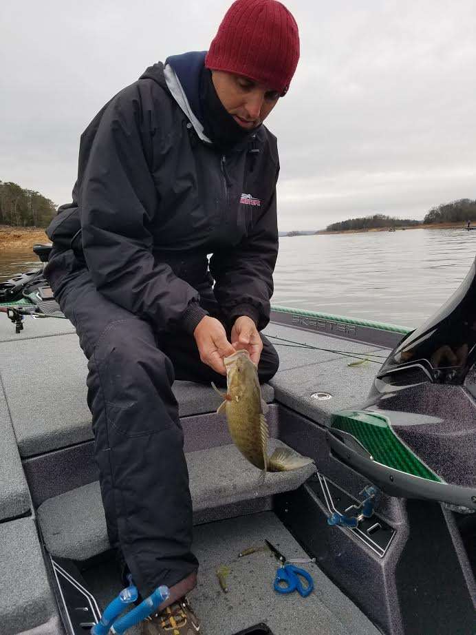After running a bunch of other spots,  Marty pulled into a flotilla of other boats, and went to one of his many weigh points.  It had payed off with his 1st keeper of the day. A nice 2lb smallmouth. 