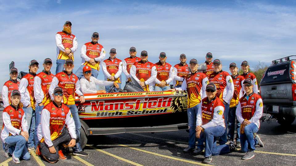 The first team photo of many as the student anglers wear their jerseys and pose with Clouse. 