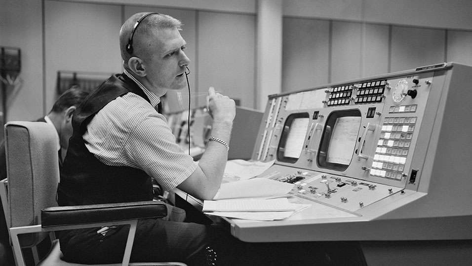 This is Gene Kranz, working at his console at NASAâs Mission Control at JSC. He was probably the Soochâs top score of an interview, and was very poignant in explaining the shared feeling of great accomplishment in that room when they helped put men on the moon. There was also a brush with Buzz Aldrin at a week of festivities celebrating the moon walkâs 20th anniversary, but another notable was Red Adair, the famed oil well fire fighter. He told stories on Redfish Island in Galveston Bay for a Lakewood Yacht Club shrimp boil with steel drum music with huge ships passing by in the Houston Ship Channel. 