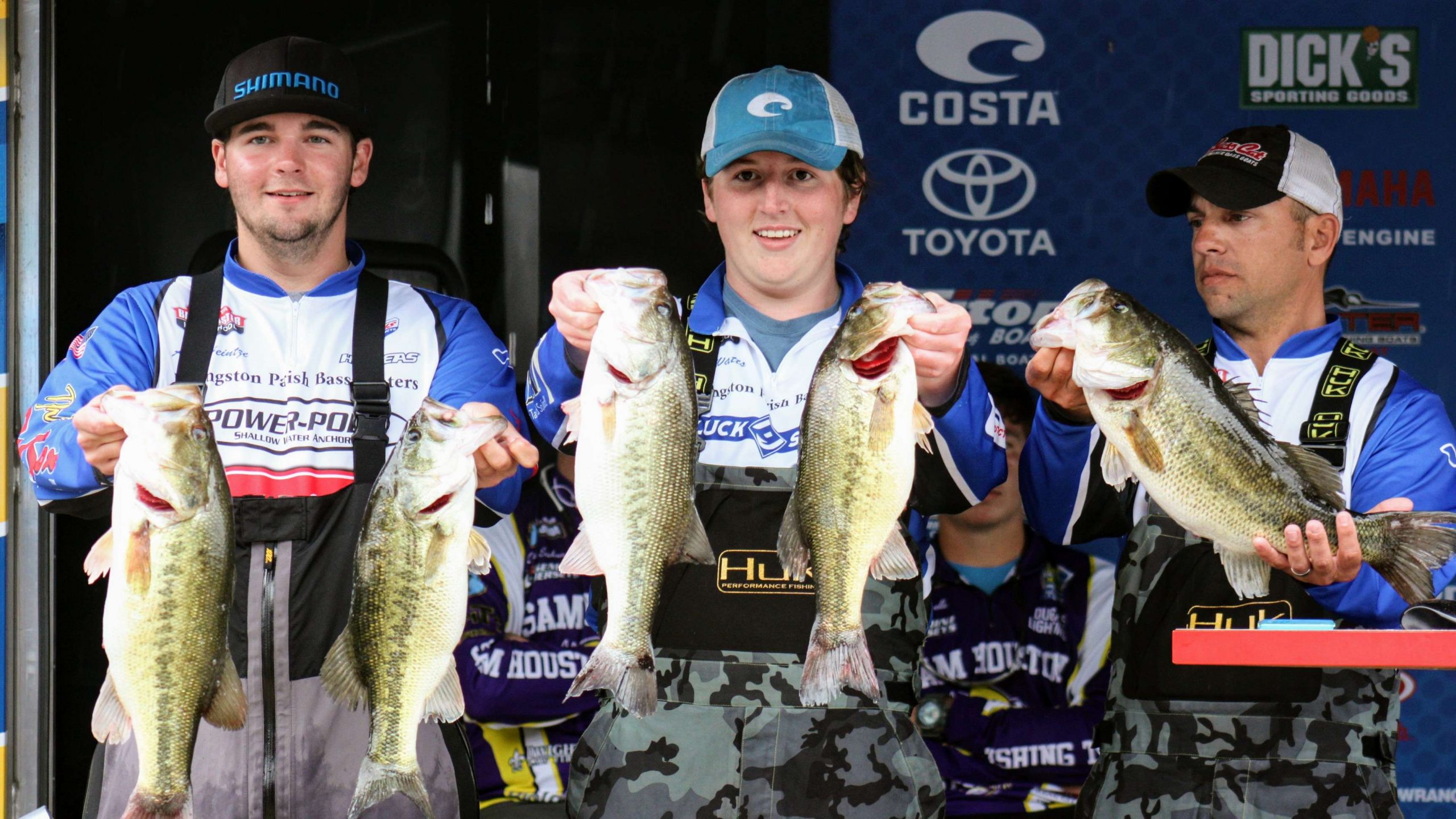 And boy, did they catch some fish. Pictured, from left, are
  Heintze, Watts and captain Scott Dimaio hoist a five-bass limit that
  weighed 22-3. That was the day's second best haul, but it was pound
  shy of the leaders.
