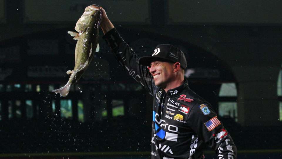 Brent Ehrler shows off his big bass to the thrill of the crowd at Minute Maid Park.