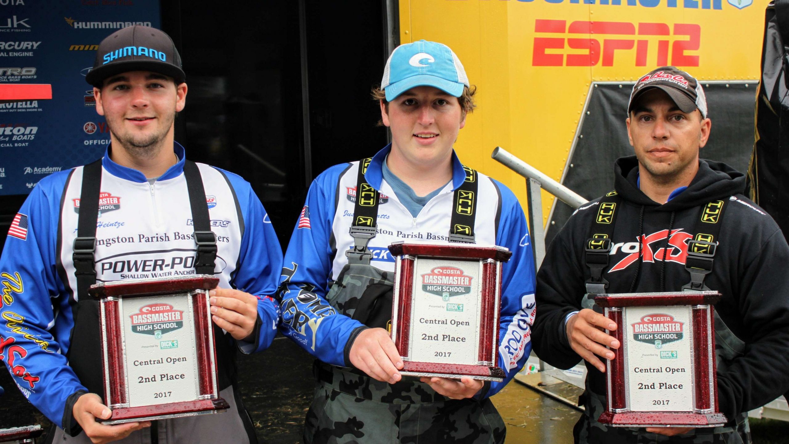 Heintze, Watts, and Dimaio proudly display their second place
  trophies.

