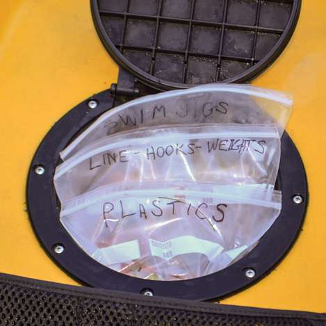 5. Now you can put tackle boxes and Ziploc bags Â­inside, and the net keeps them at your fingertips.
