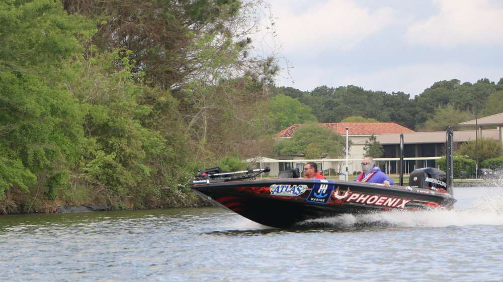 Greg Hackney zips by in hopes of being the first angler to complete the âgrand slamâ of fishing, after winning the Forrest Wood Cup, FLW AOY, and the Toyota Bassmaster AOY. 
