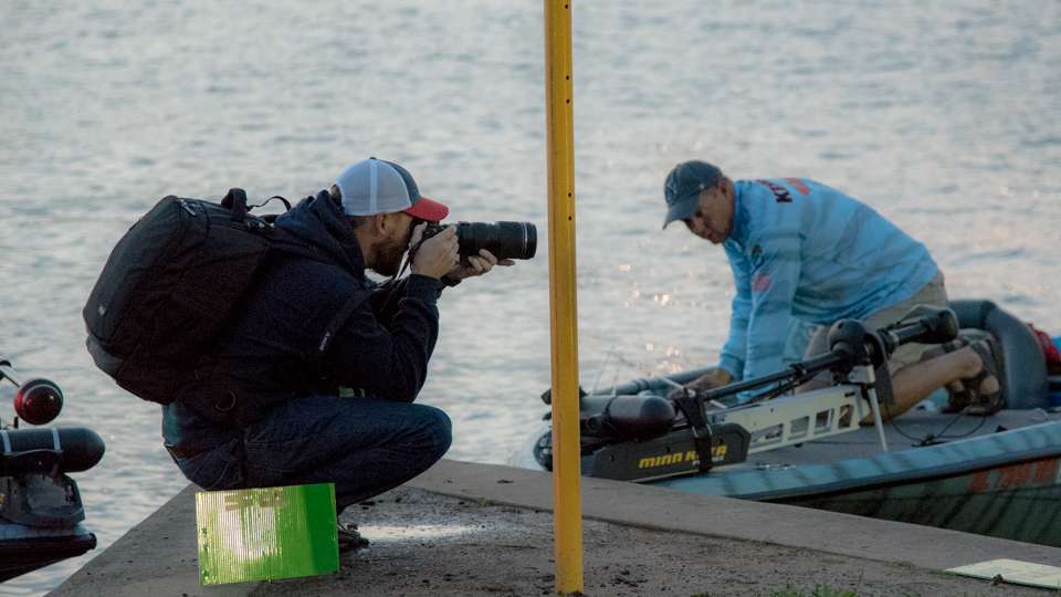 Garrick Dixon takes pictures of anglers for his gallery.