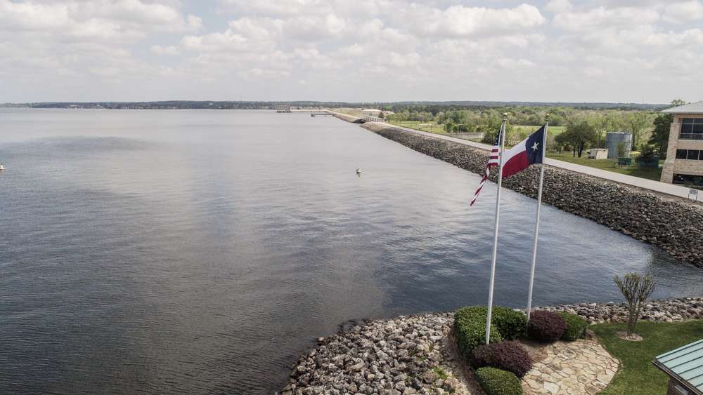 The Texas flag waves in the wind overlooking the southern end of the lake. 
