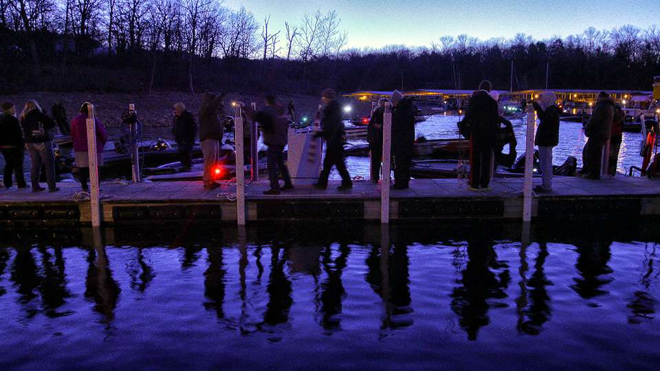 Anglers file onto the dock to prepare for the day. That means co-anglers finding pro anglers, loading tackle and getting bundled up for a chilly ride across Table Rock Lake. 