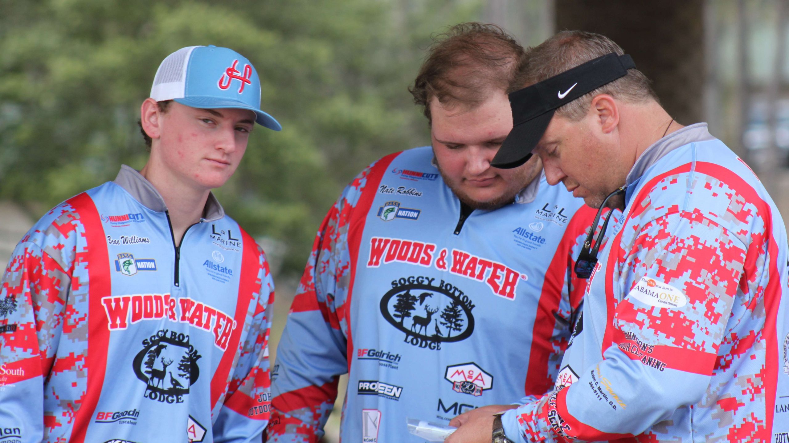 Brae Williams and Nate Robbins of Hillcrest (Ala.) High consult with their boat captain during registration.