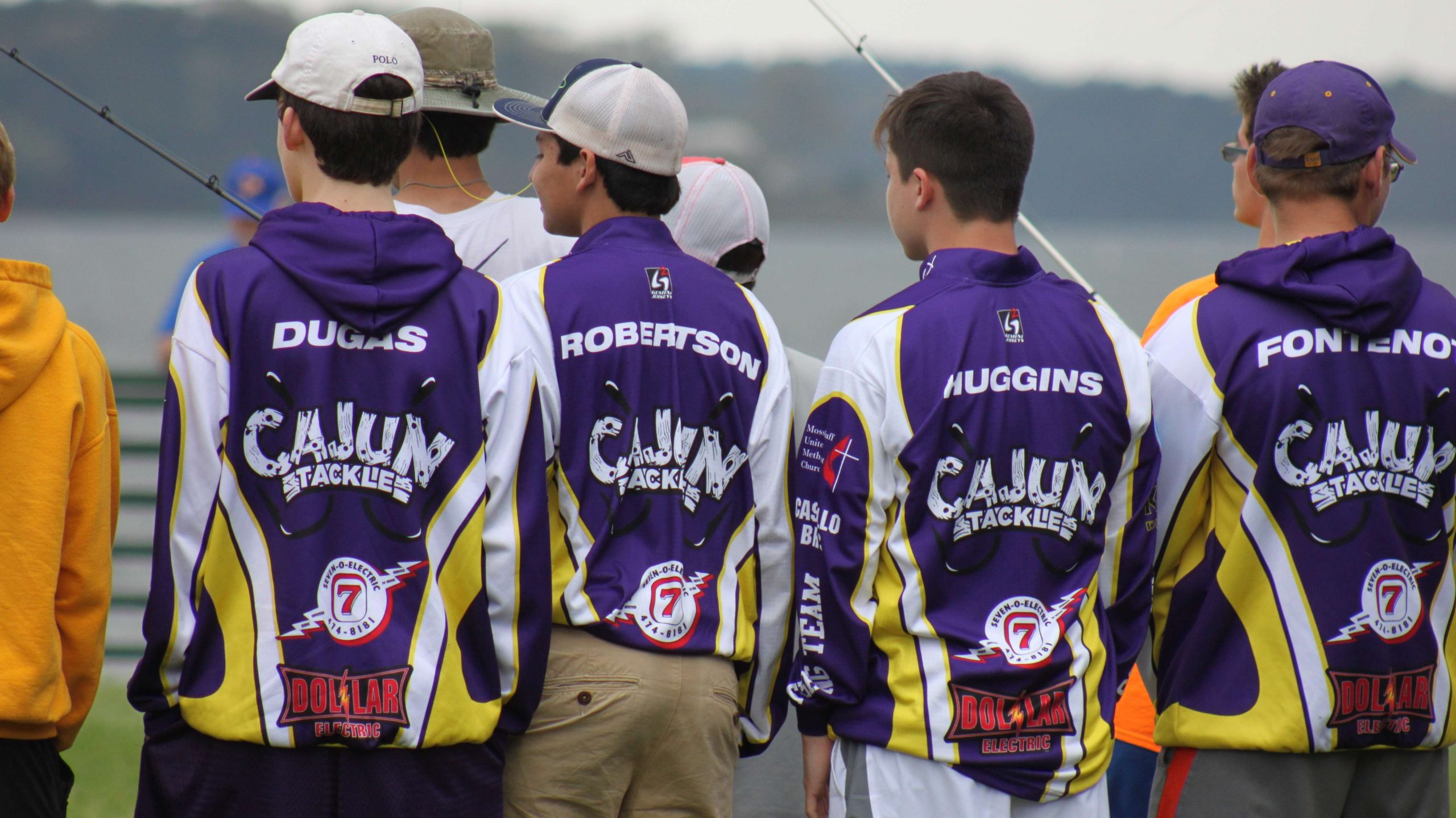 Purple and gold are popular colors in these parts, but this
isn't Team LSU. It's anglers from Sam Houston (La.) High School
watching the action at the popular Shimano station just before the
registration meeting begins.