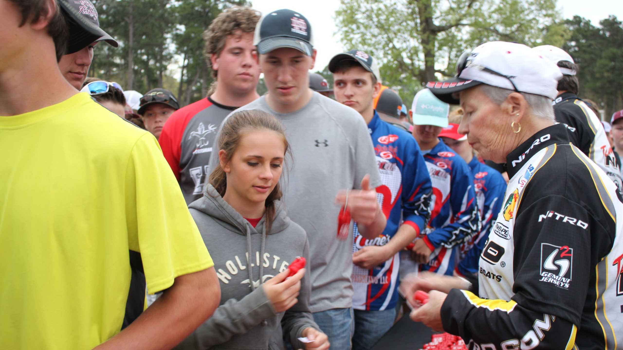 Cindy Breaux distributes the Toyota fobs to anglers.