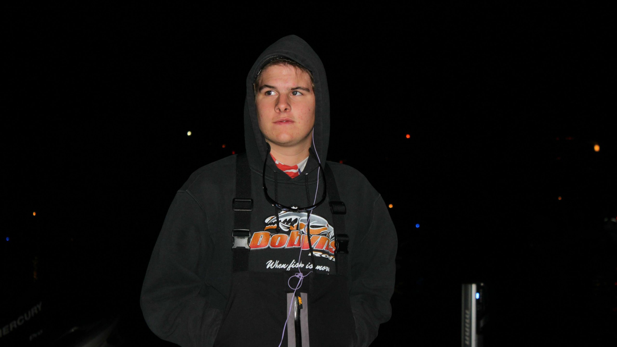 Ethan LeGare of Lovejoy (Tex.) High School awaits his boat
number to be called in the pre-dawn darkness.