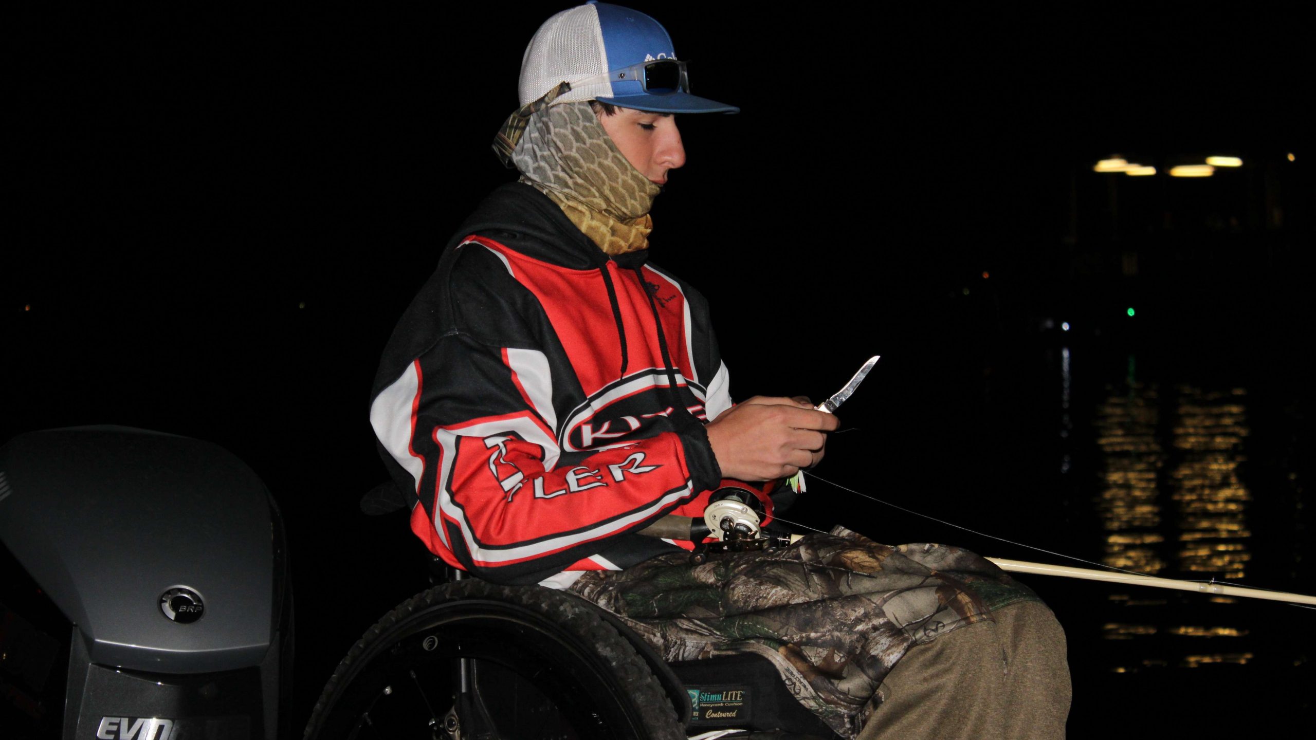 Tucker Roe of Natchitoches Central (La.) High works on a lure
while awaiting take-off.