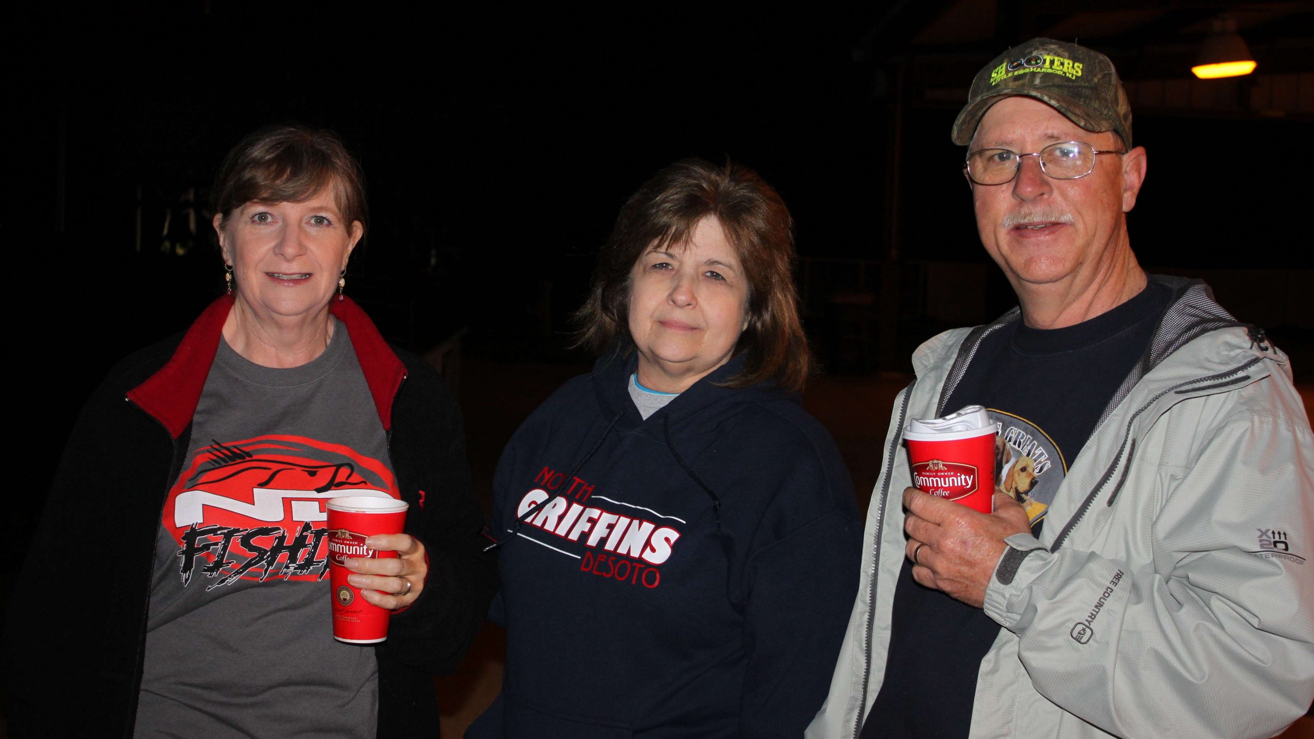 Fans are a big part of any Bassmaster experience, and that's
especially true with the high school series. North Desoto (La.) High
School is right up the road from Cypress Bend Marina, and the school
is well represented in the Central Open. Here, fans Roxie Berry,
Duwanna Herring, and Jimmy Berry enjoy some coffee on the cool March morning.