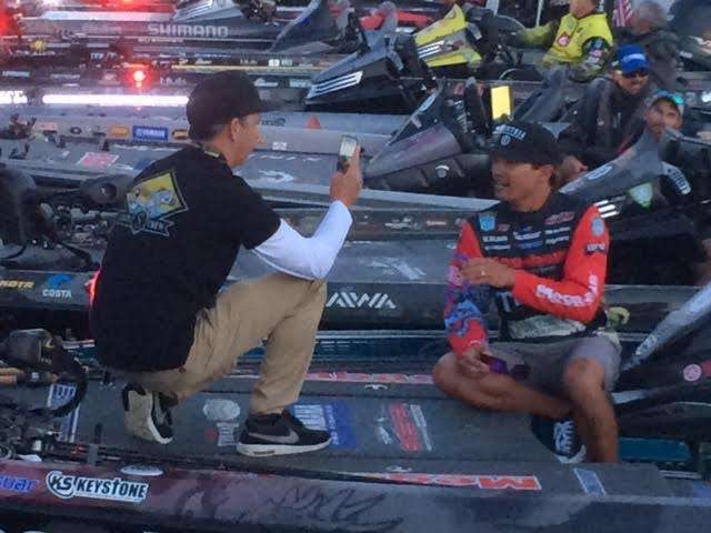 Chris Zaldain finishing a morning interview minutes before take off. The sponsor obligations are as large a part of Classic week as is the fishing.