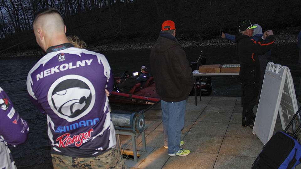 Parents and coaches gather on the dock to cheer on their anglers.