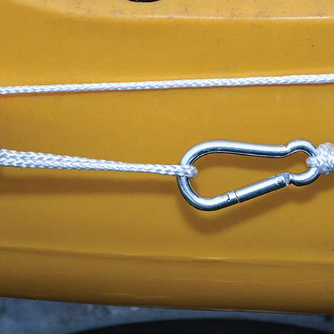 4. Tie the carabiner to form your loop. Leave a tag end on your knots so you can tighten or loosen the trolley rope for optimal tension after the first use.