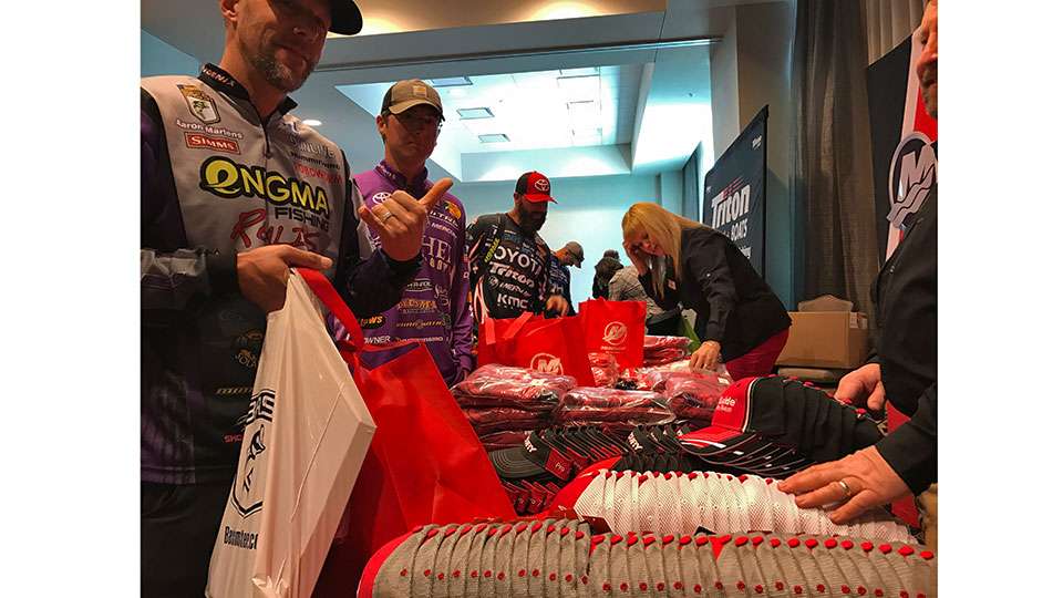 Aaron Martens, John Garrett and Gerald Swindle go through the Mercury booth in the gifting suite, where anglers made off with sacks of new goodies from a bunch of B.A.S.S. sponsors. 