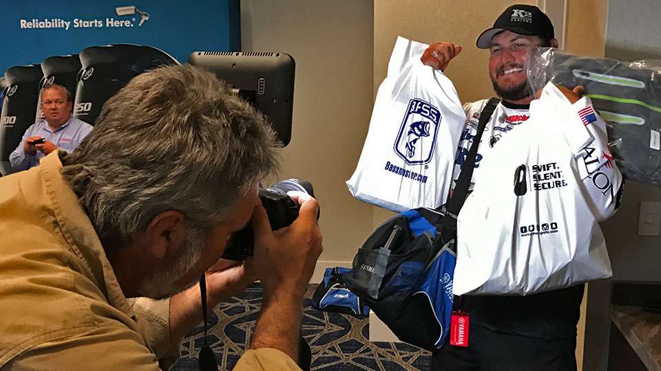 B.A.S.S. sponsors give the competitors enough to fill multiple bags. Cliff Crochet shows off his SWAG (Stuff We All Get) to photographer James Overstreet. 