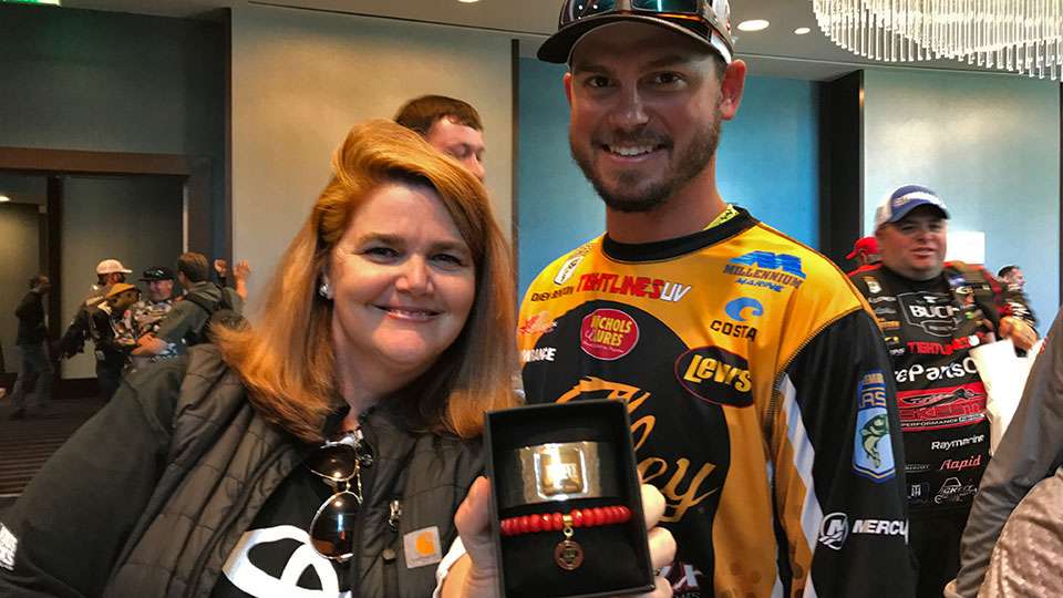 Even the anglersâ wives scored. Here Drew Benton picks out a Rustic Cuff bracelet for his wife, Amanda, with the help of Toyota Trucks Bonus Bucksâ Kendell Callaway Mooney. She helped a number of anglers decide which design their wife/girlfriend might like. 