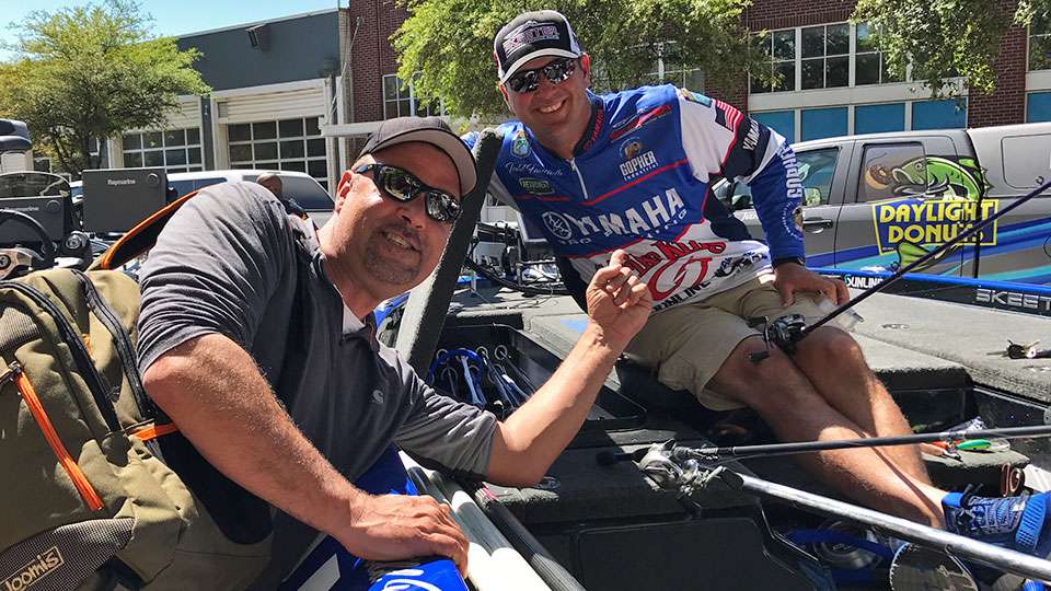 Mark Zona stops an interview with Todd Faircloth to pose for a shot. Zona was trying to get the inside scoop on what exactly was going on at Lake Conroe so he could report on Bassmaster LIVE.