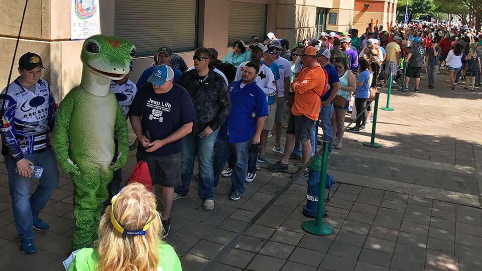 The GEICO Gecko entertains fans waiting for the ball parkâs doors to open. People were lined up all the way around two sides of the building.