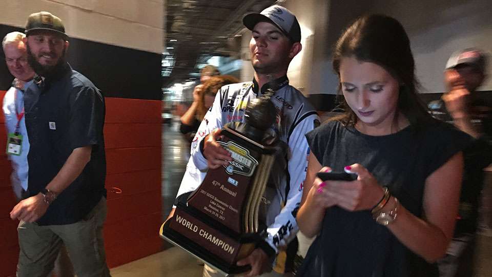 Jordan carries the trophy through the bowels of Minute Maid Park, with the Champion's Toast coming up on the list of to-dos, while Kristen responds to well-wishers. Lee already had well over 200 people contact him in some fashion.