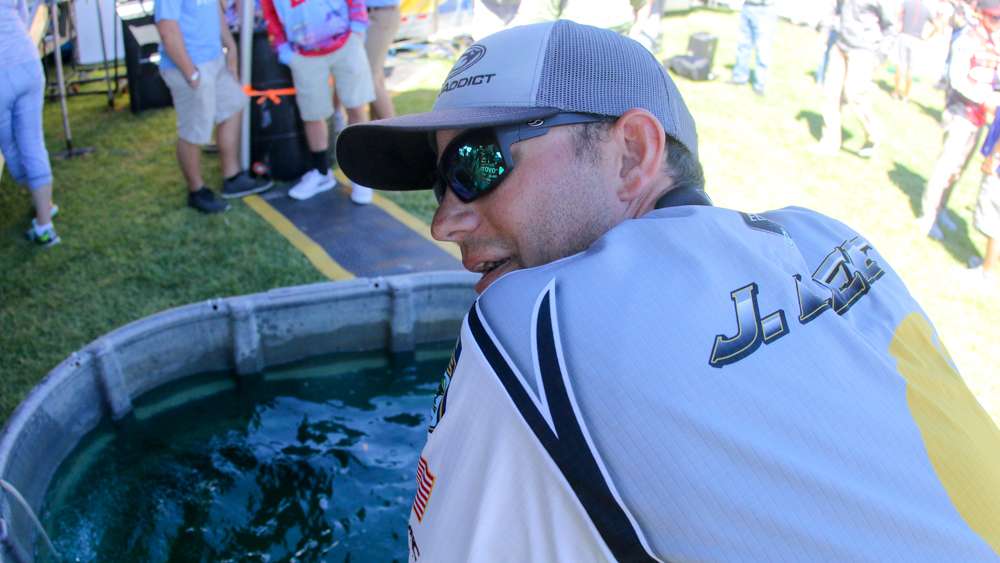 Newly crowned GEICO Bassmaster Classic presented DICKâS Sporting Goods champion Jordan Lee talks behind the stage.