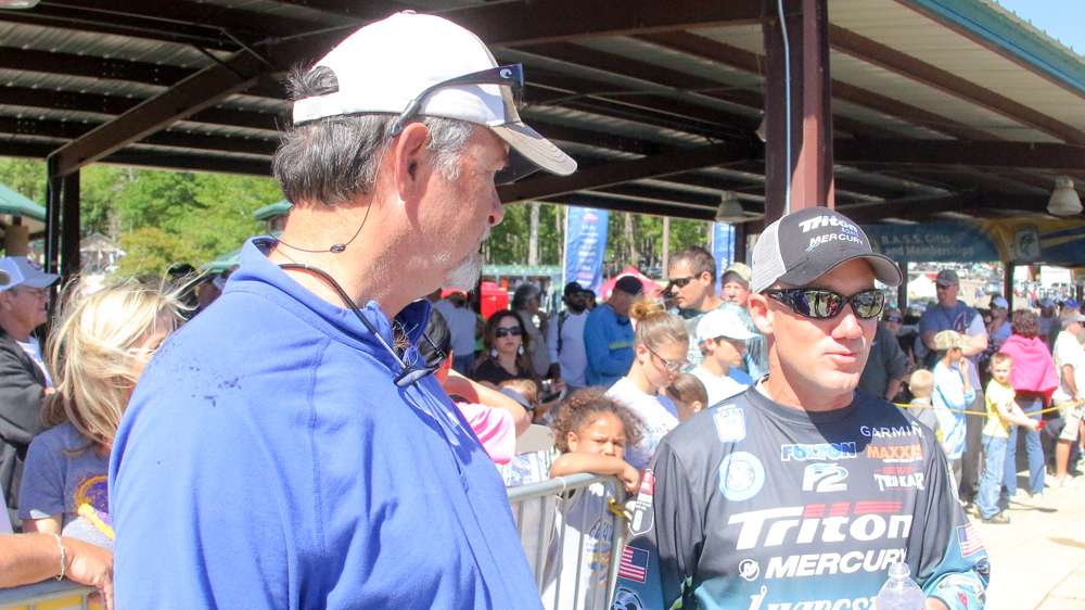 Steve Bowman discusses fishing trips with Brent Chapman.