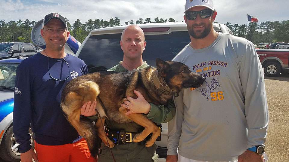 Officers Ted Dahlin and Chris Knowlton with Brian Robison and Elliott, the K9. Elliott was funded through a prior Robison donation to K9s4Cops.
