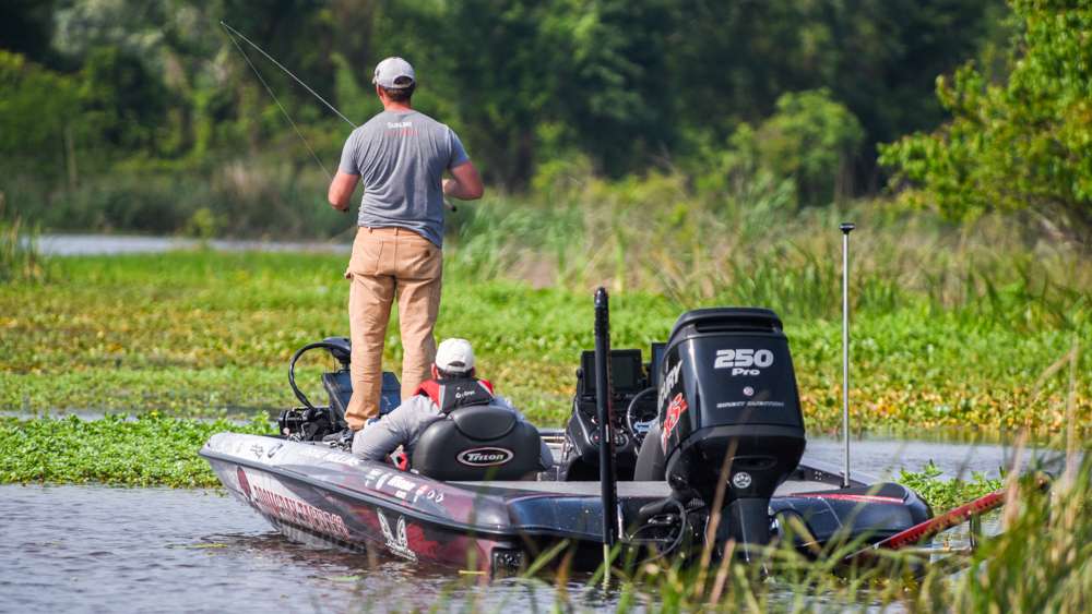 Mullins was working a variety of baits while slowly moving down along the edge of the matted cover on the surface. 
