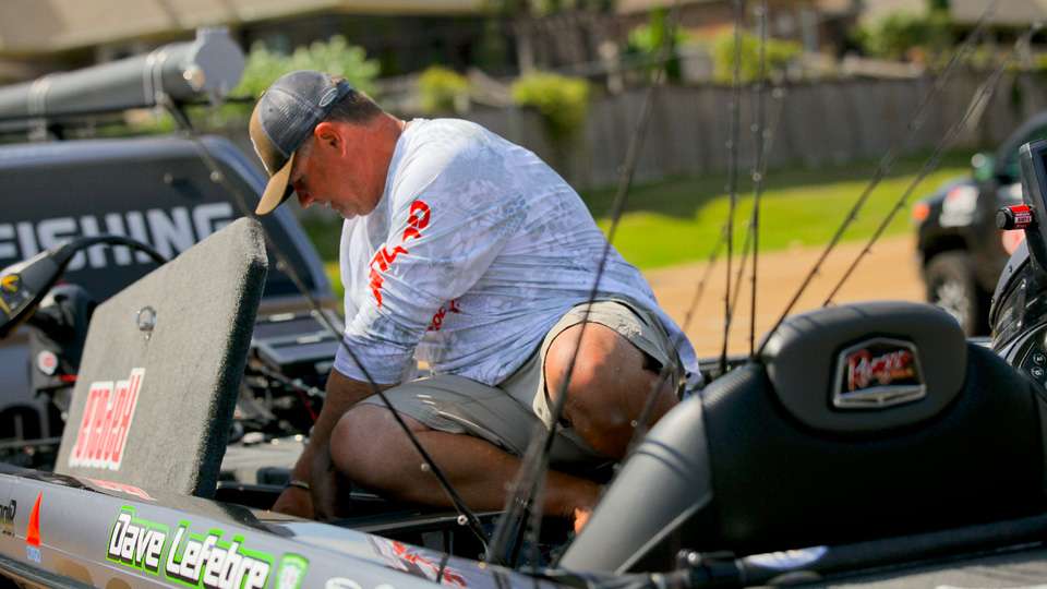 Dave LeFebre was pulling literally every rod he owned out of the locker to work on tying on new baits and line. 
