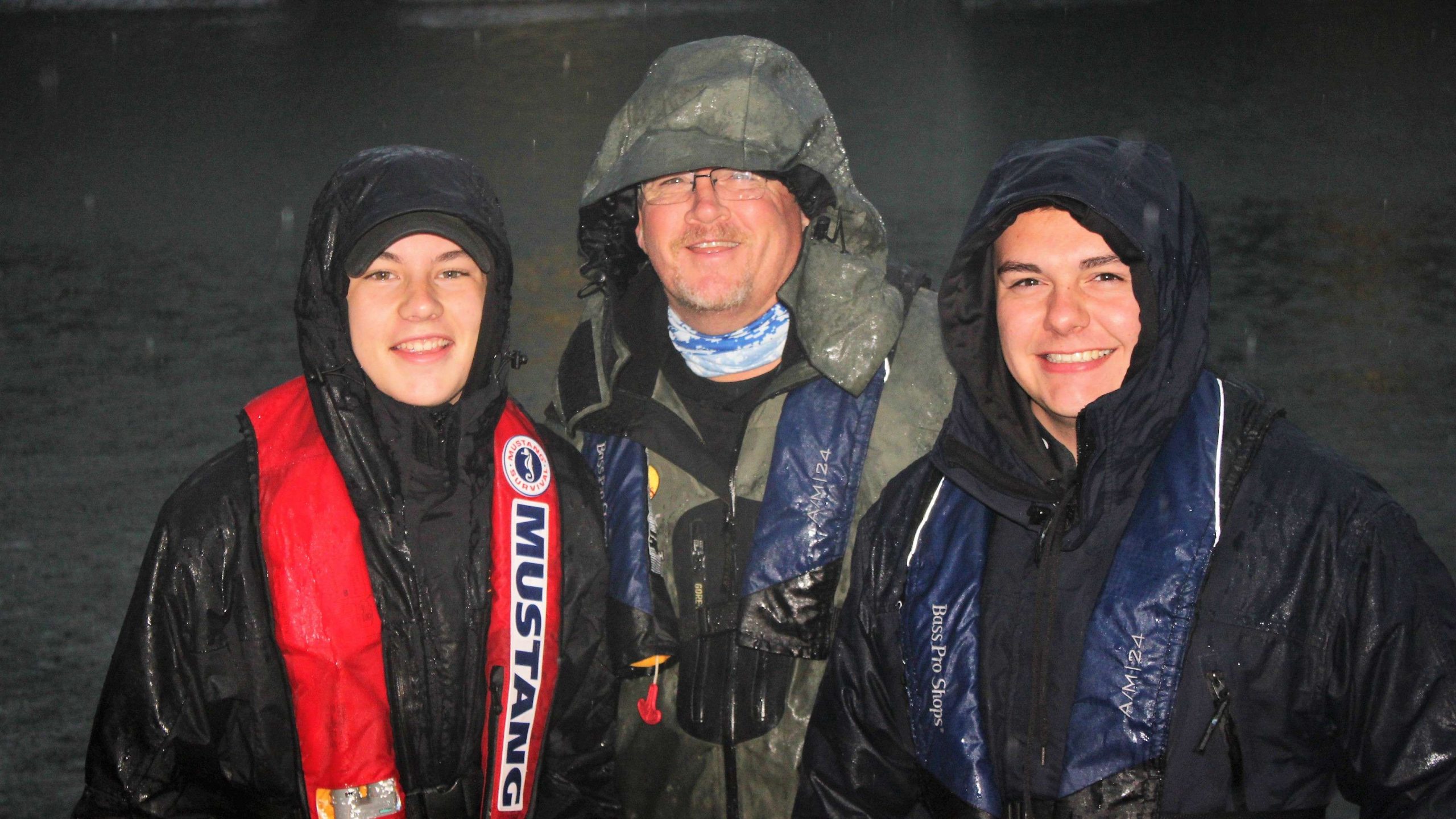 All smiles despite the rain beginning to really come down. This is the team of Mason Mitchell, left, and Logan Bailey of Oklahoma. Captain Bruce Collins is at middle.