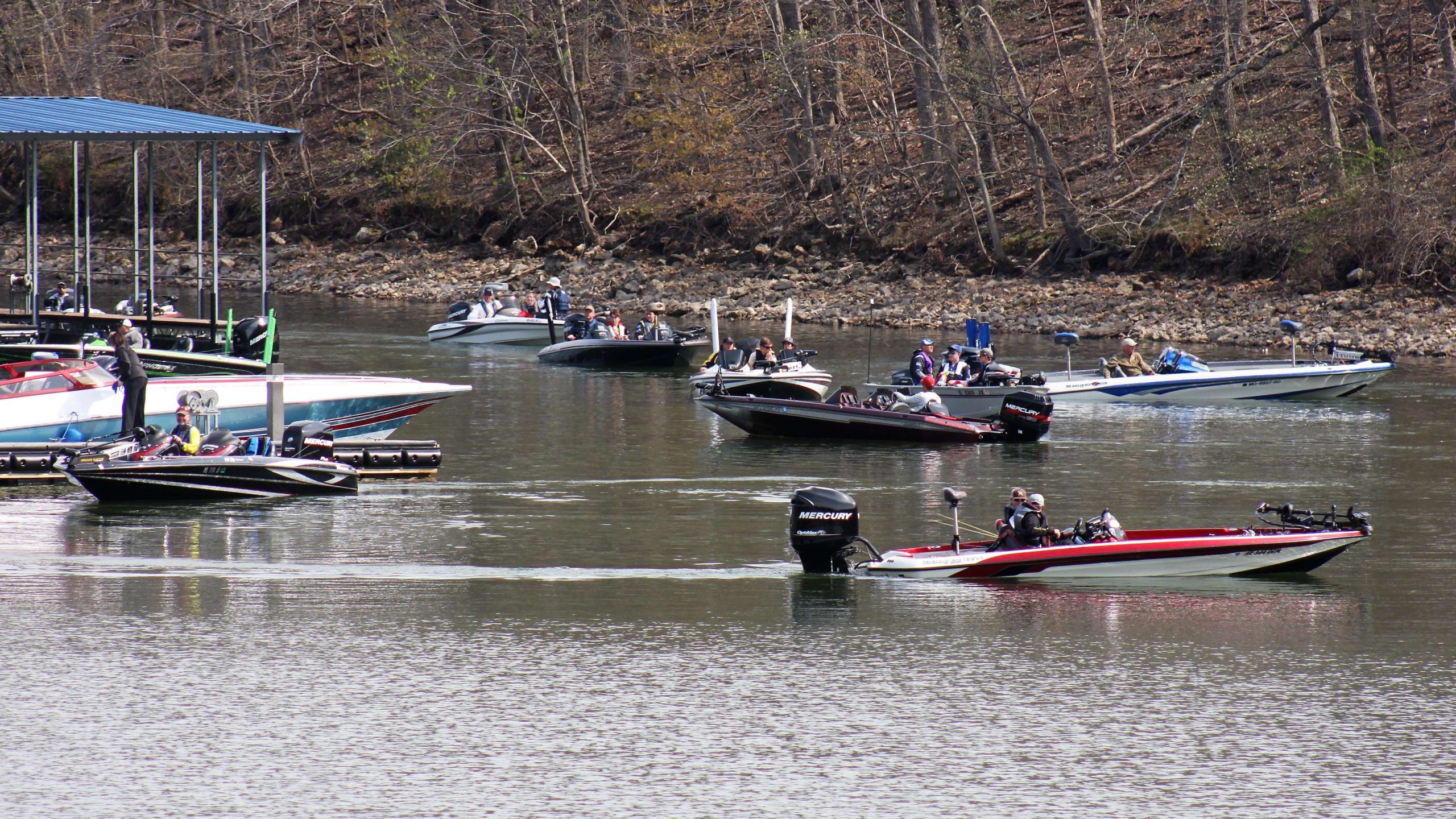 Boats begin to arrive at the Lake of the Ozarks State Park in Osage Beach for the high school weigh-in.