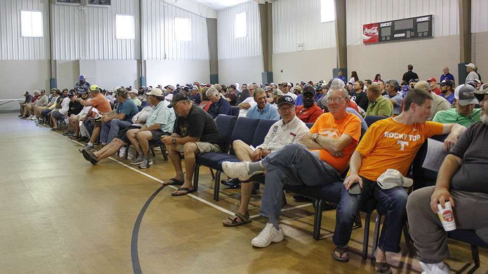 The room fills up as most of the 390 fishermen find a seat.