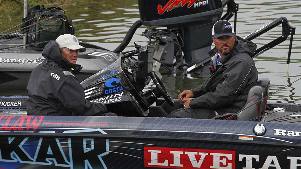 Scott Martin pulls in and waits in his boat for a weigh-in bag.